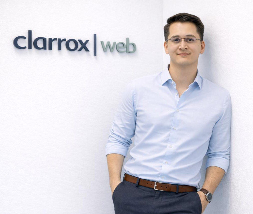 Daniel Klein in front of the ClarroxWeb sign